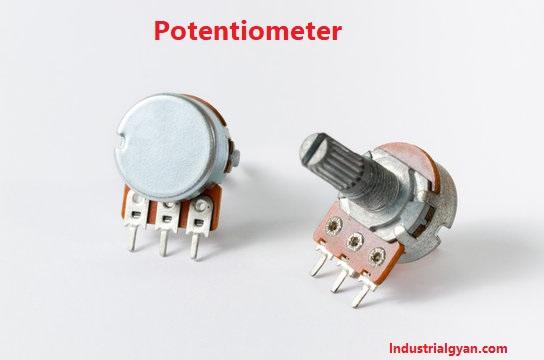 A close-up image of a potentiometer, an electrical instrument used to measure and regulate electrical potential. The potentiometer has a rotating knob or lever that can be adjusted to vary the voltage output. The device has three terminals, including two fixed endpoints and a third movable contact that can be adjusted to control the voltage output. The potentiometer may be housed in a metal or plastic casing, with wires or connectors protruding from the terminals